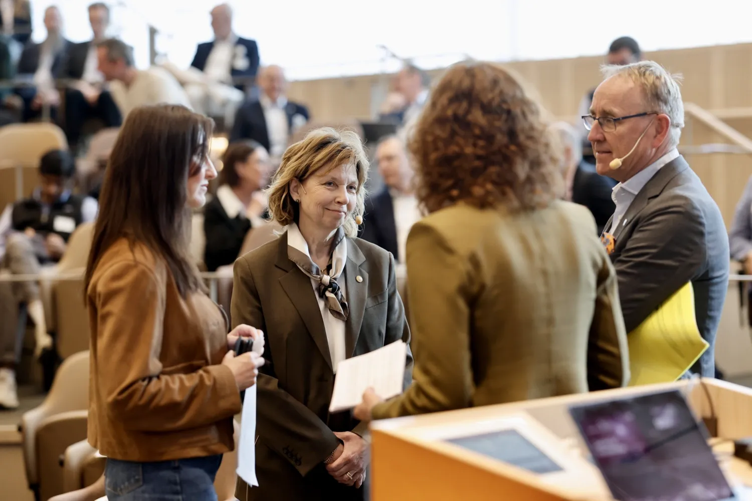Four people in conversation