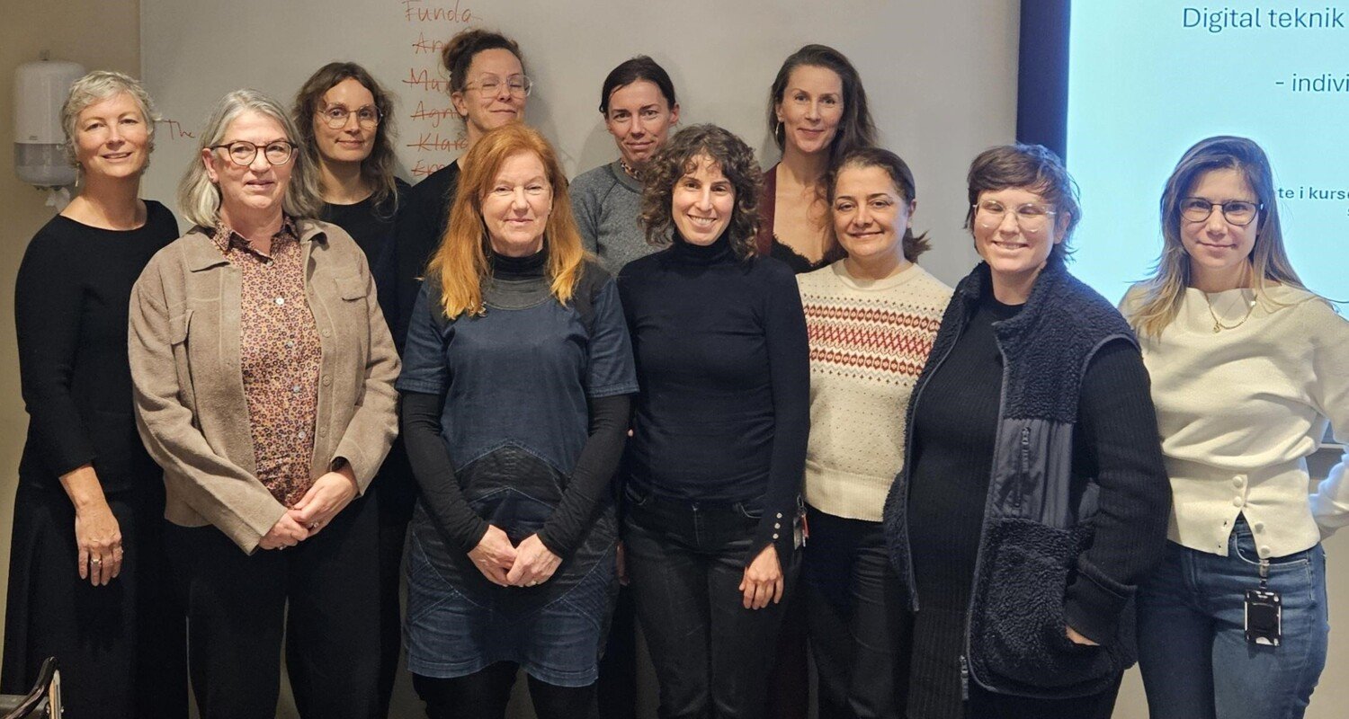 A group of teachers in a classroom.