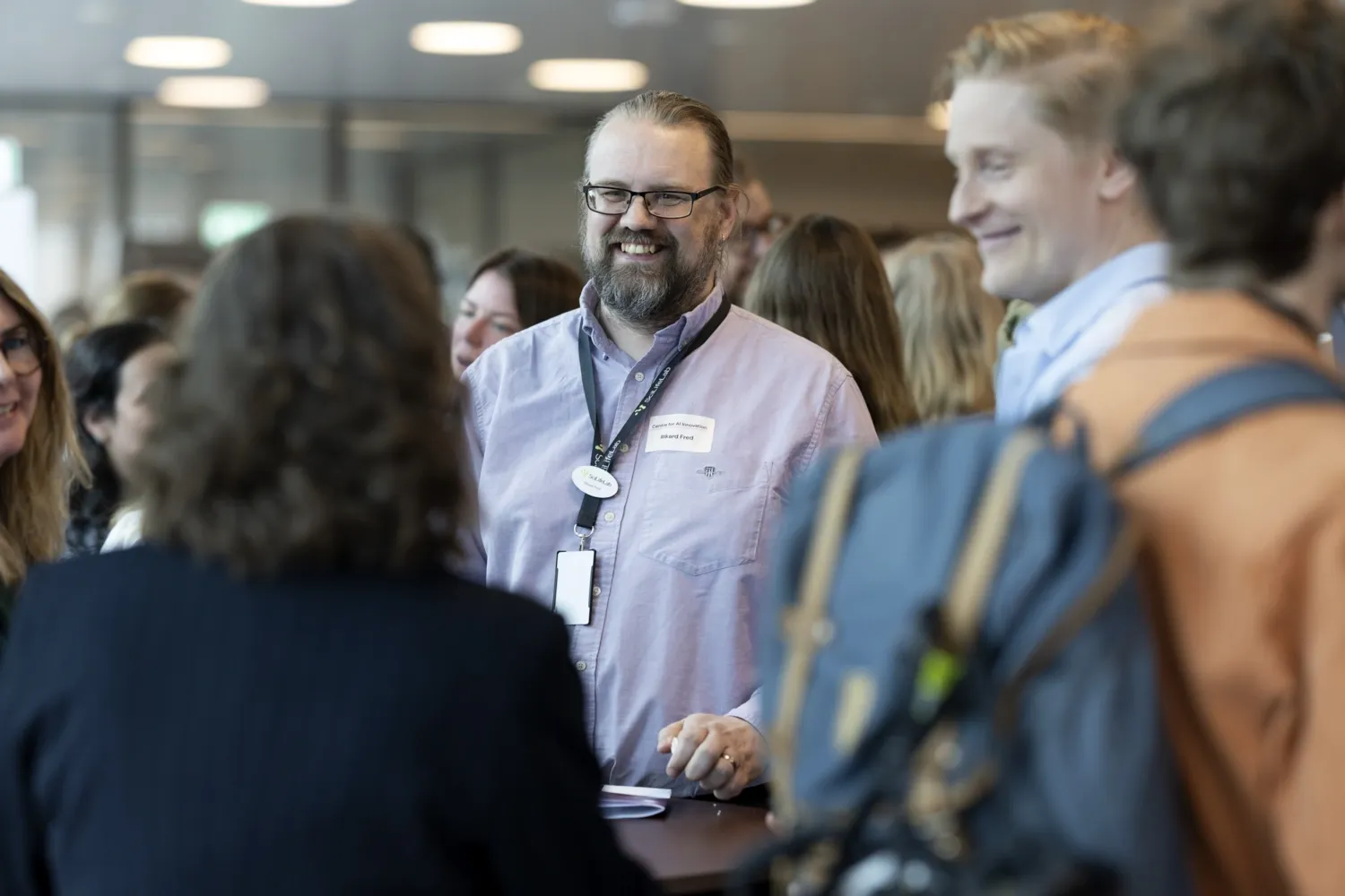 People in conversation during an event.