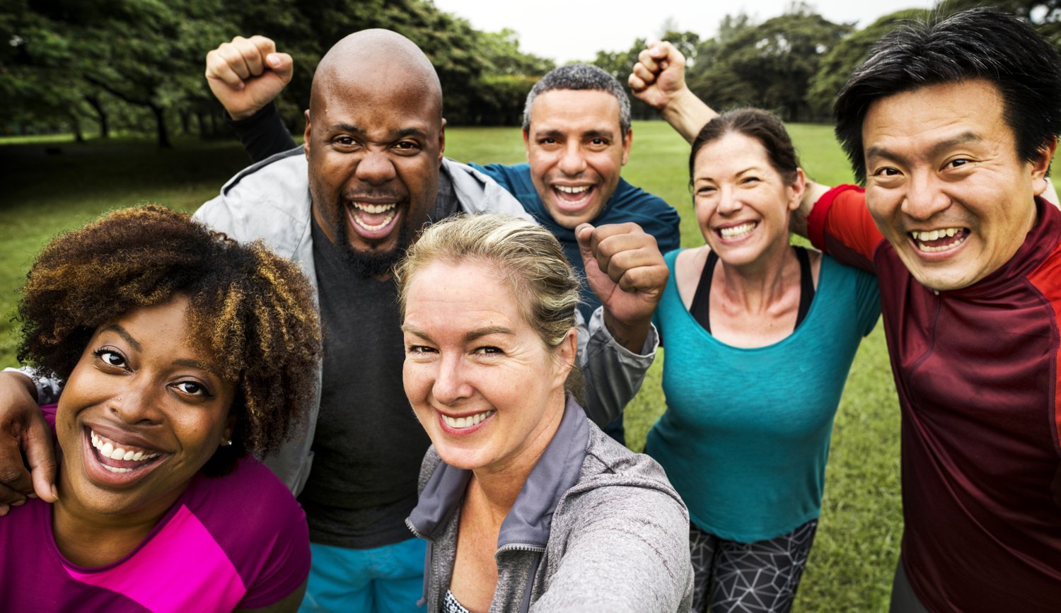 Happy people excercise together.