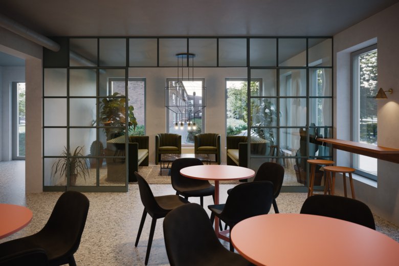 Interior from the new co-working hub A Working Lab Innomedicum, showing soft chairs and small tables.