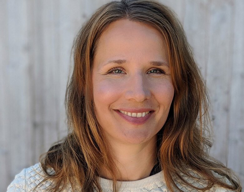 Close-up portrait of a smiling Andrea Carmine Belin