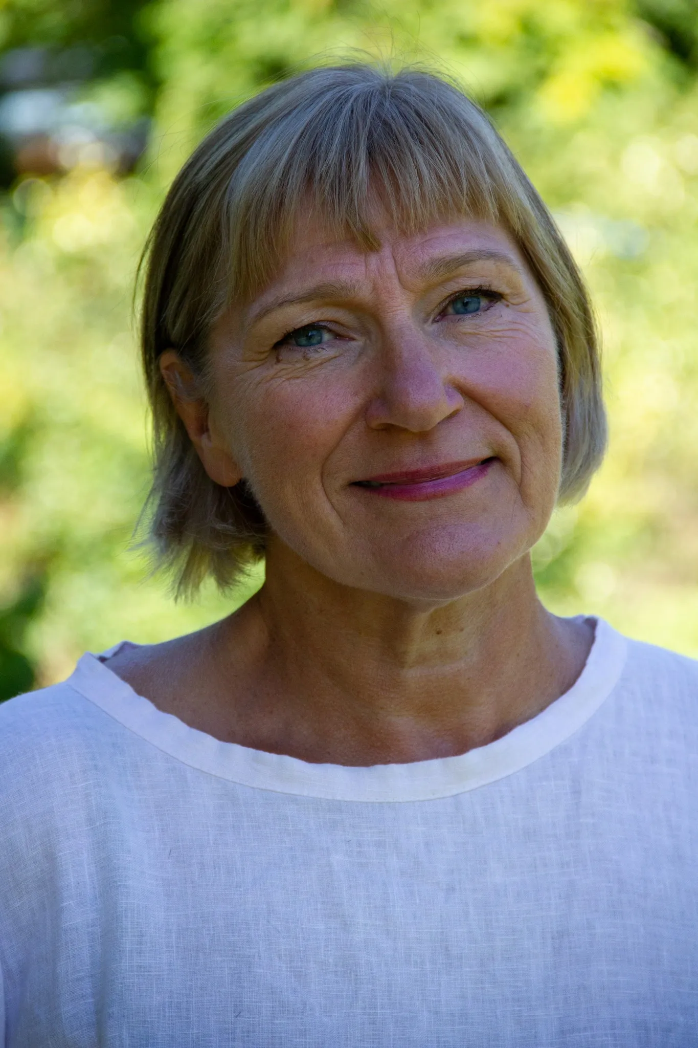 Profile photo of Anneli Eriksson. A woman with blonde hair wearing a white jumper