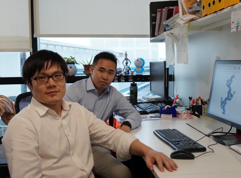 Photo of two men in an office