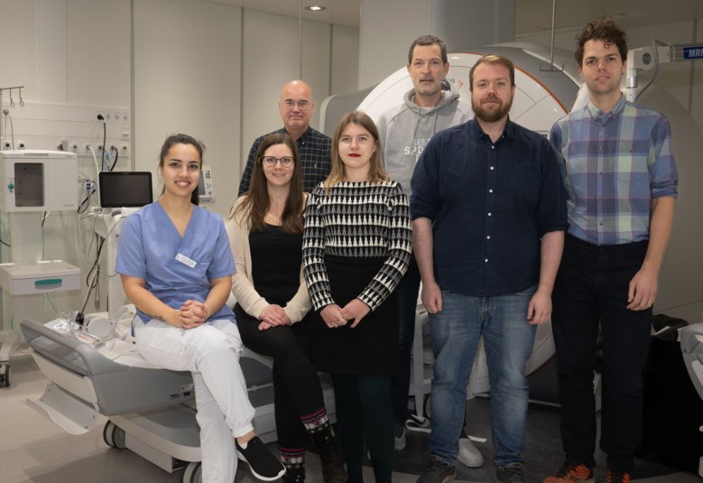 A group picture of seven researchers in hospital environment