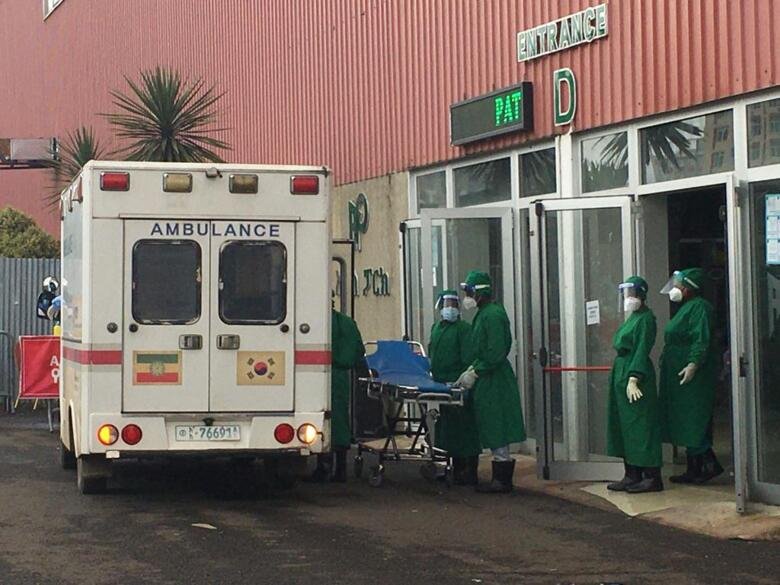 Medical care personnel in front of Millennium Hall Covid Care Center in Addis Abeba.