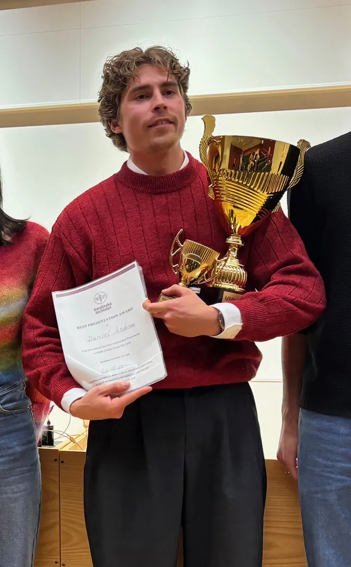 Researcher with diploma and trophy