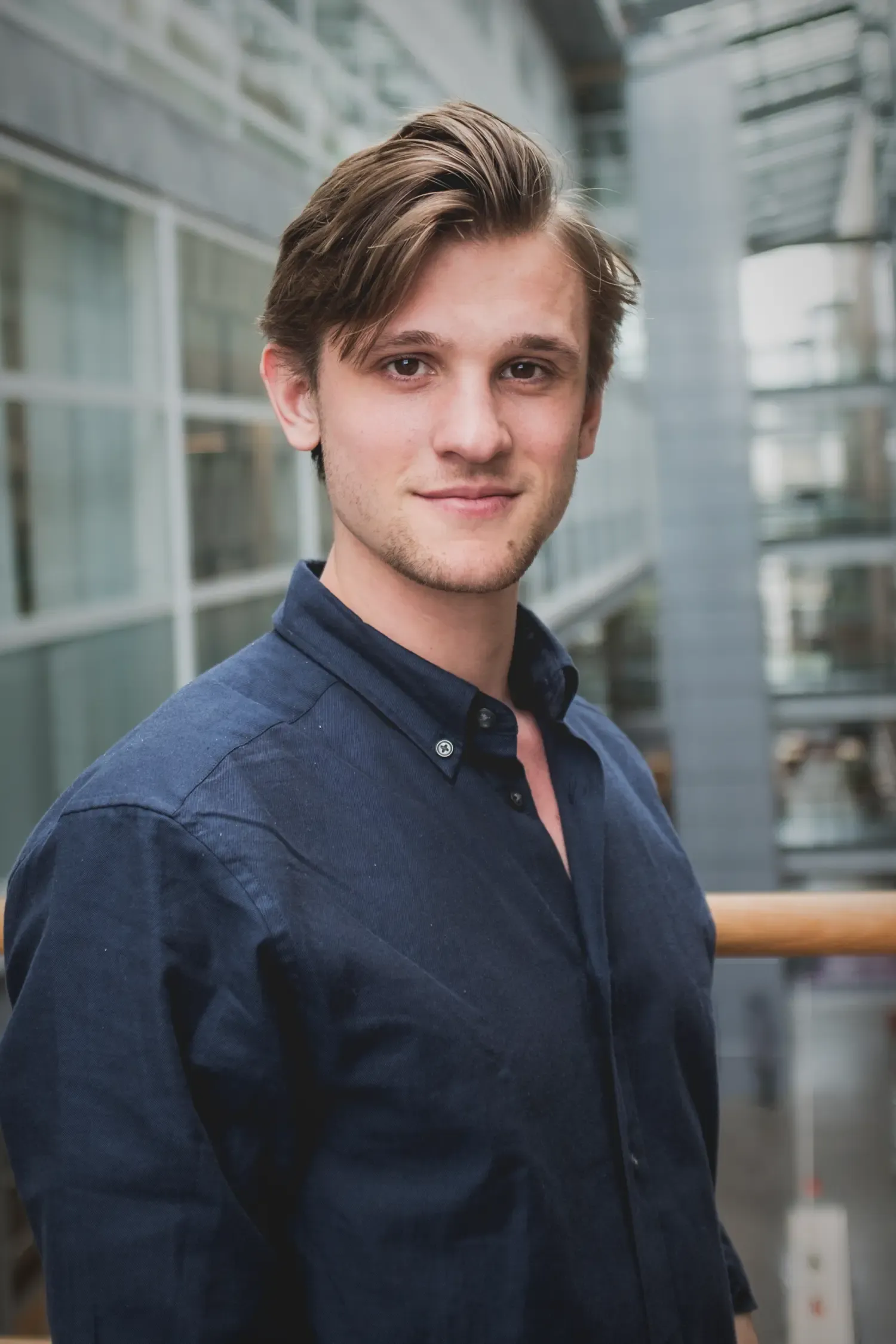 Portrait of a man in a dark shirt.