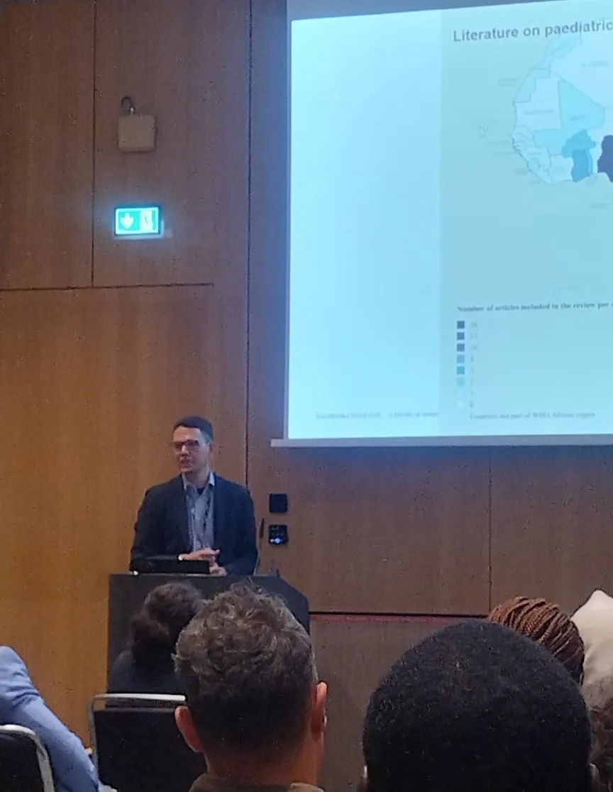 Man holding a presentation at a conference.