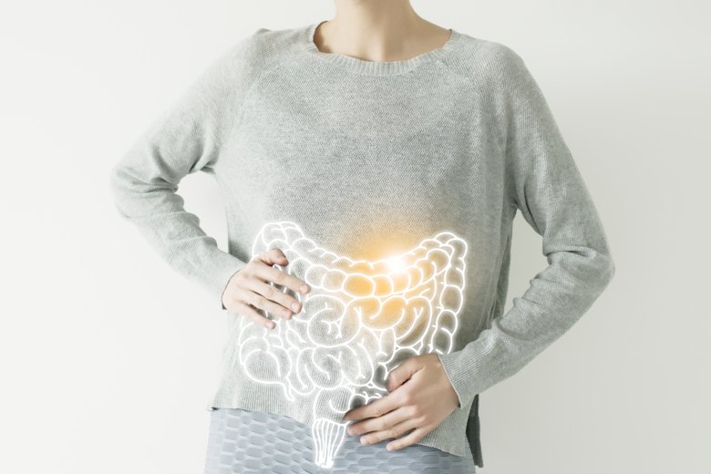 Person with illustrated intestinal system over the shirt.