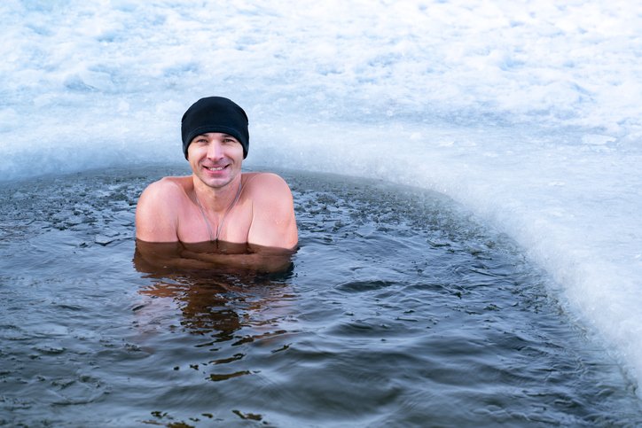 Smiling man who is ice bathing