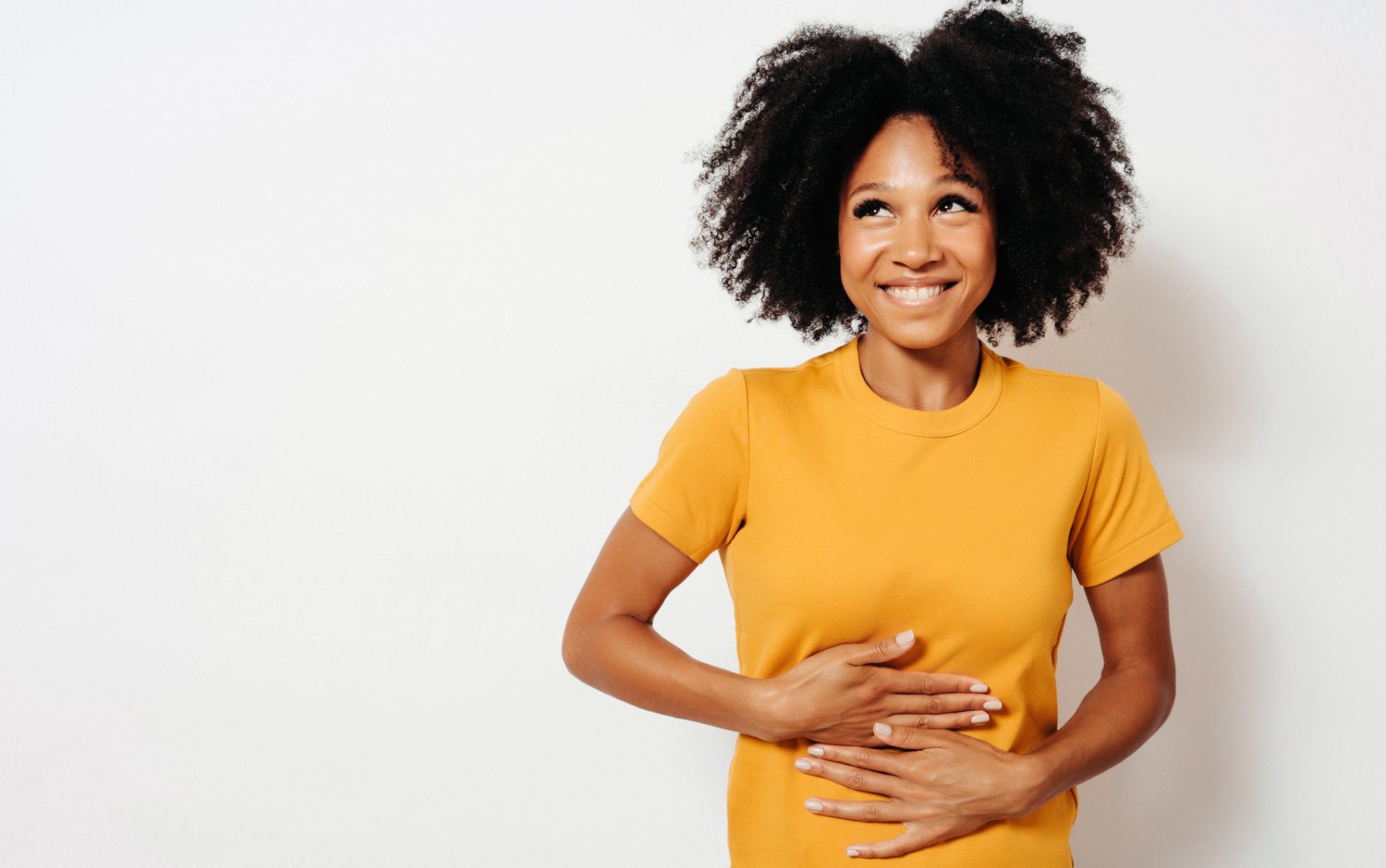 Woman with her hands on her stomach.