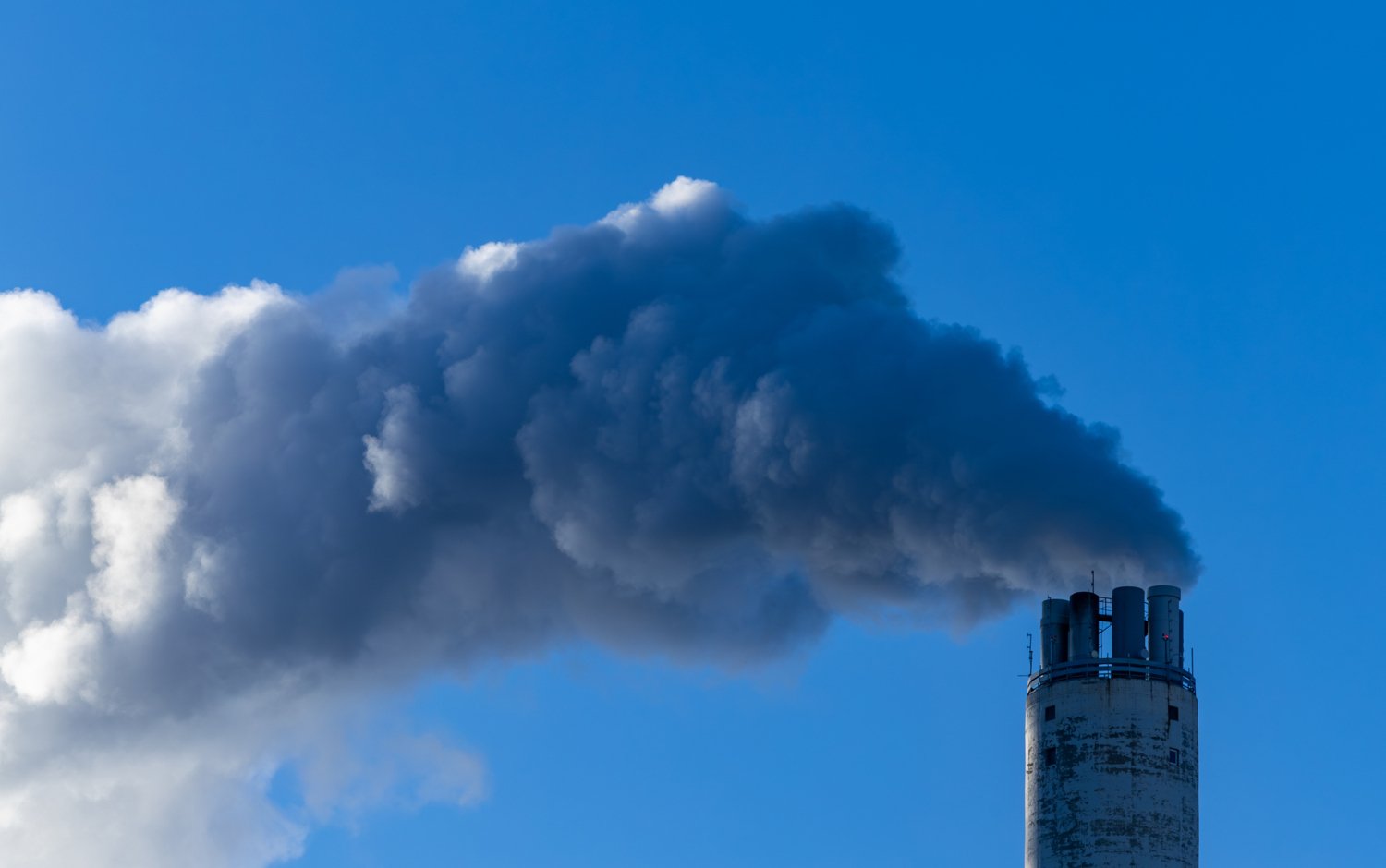 Stockholm, Sweden Steam coming out of a power plant smokestack on a cold day in winter.
