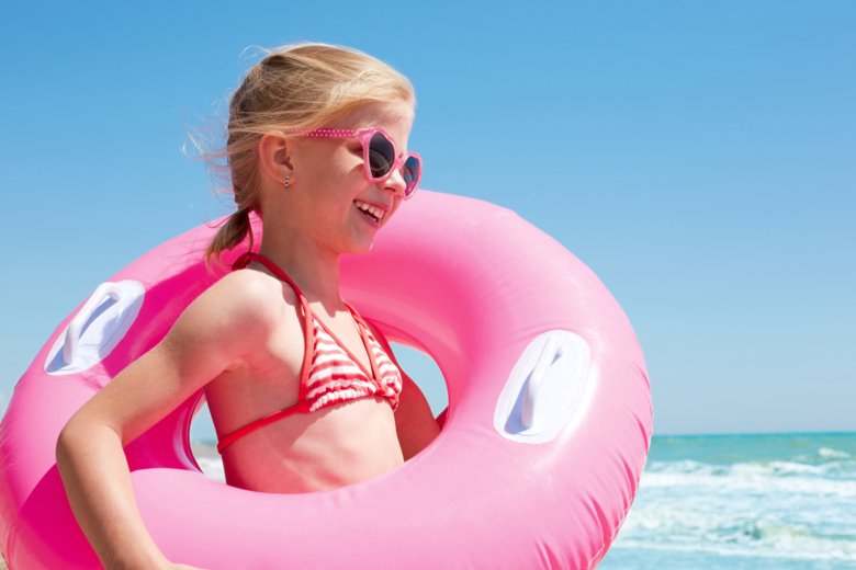 Smiling girl on a beach.