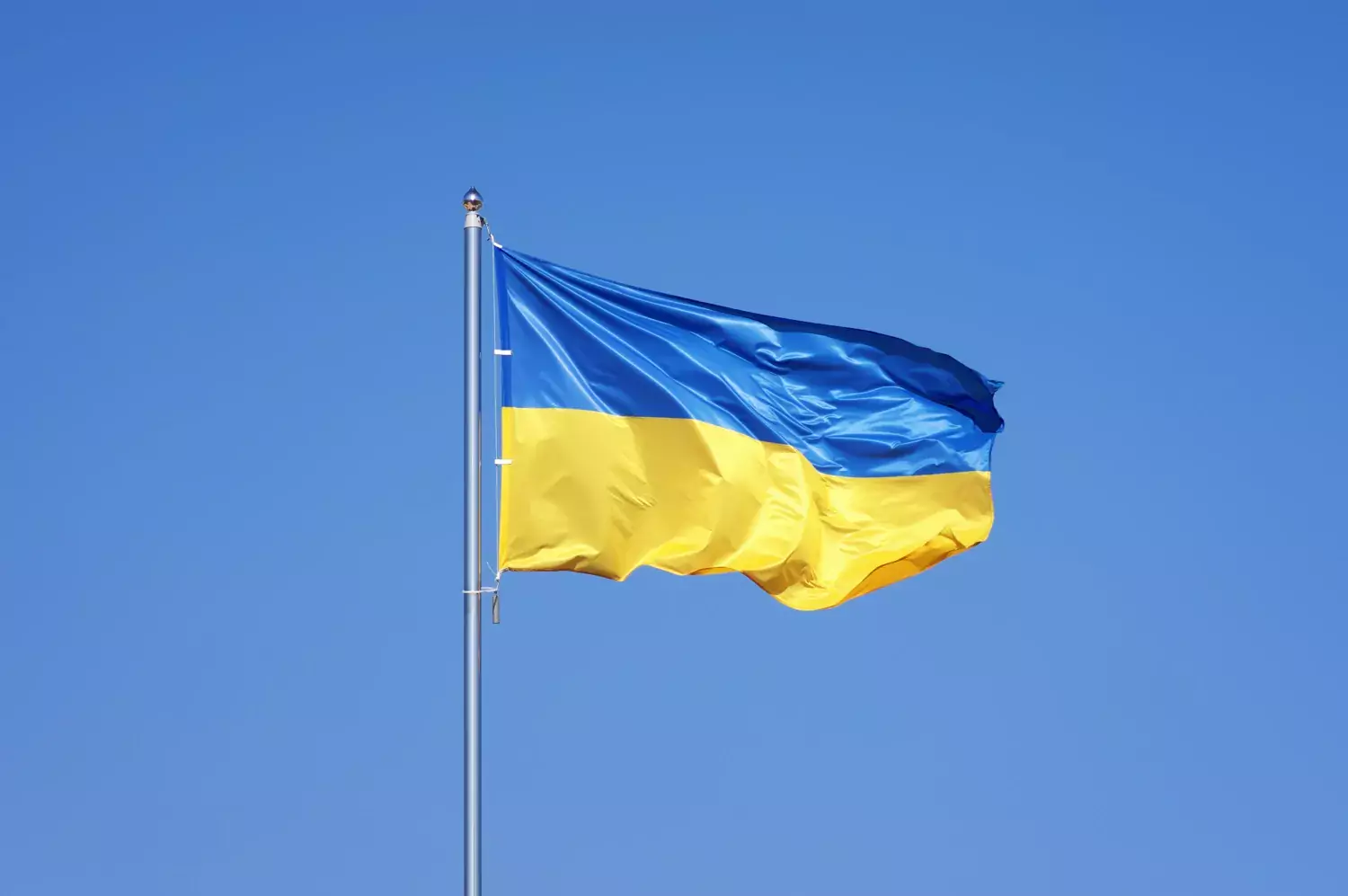 Ukraine's flag against a blue sky.