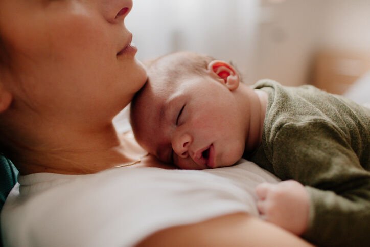 Mother holding her newborn baby