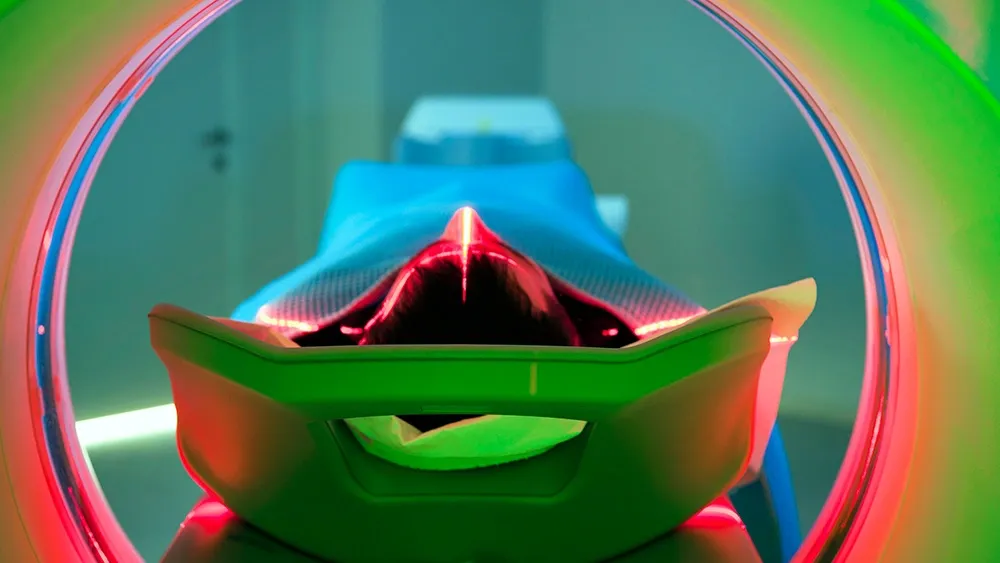 A woman is treated with radiation in a hospital.