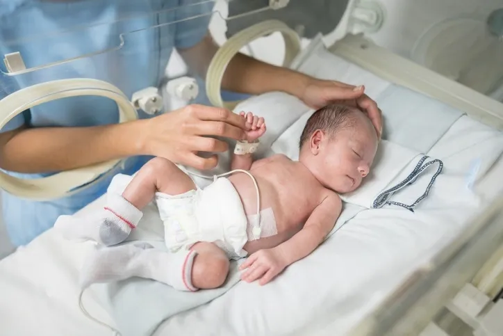 Newborn baby in an incubator