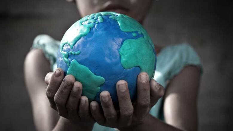A child holding a globe.