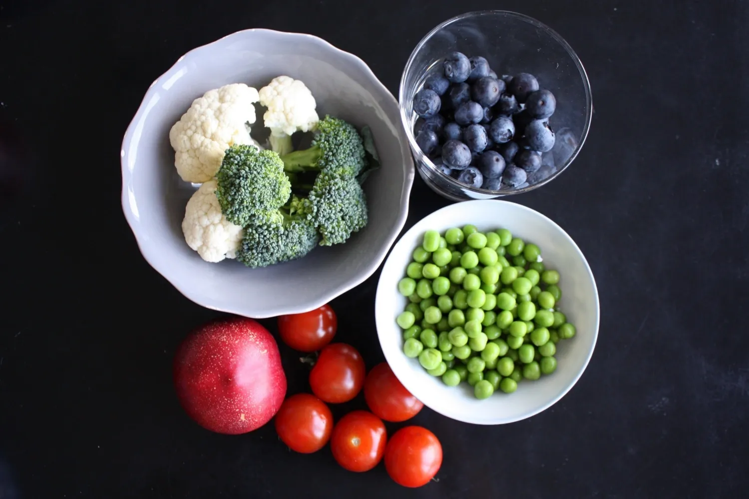 Bowls with fruit, berries and vegetables.