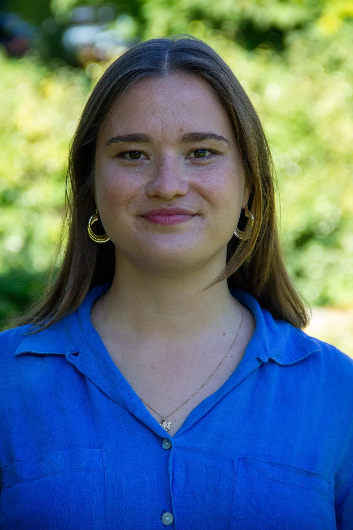 Profile photo of Hannah von Reding, a woman with brown hair wearing a blue blouse