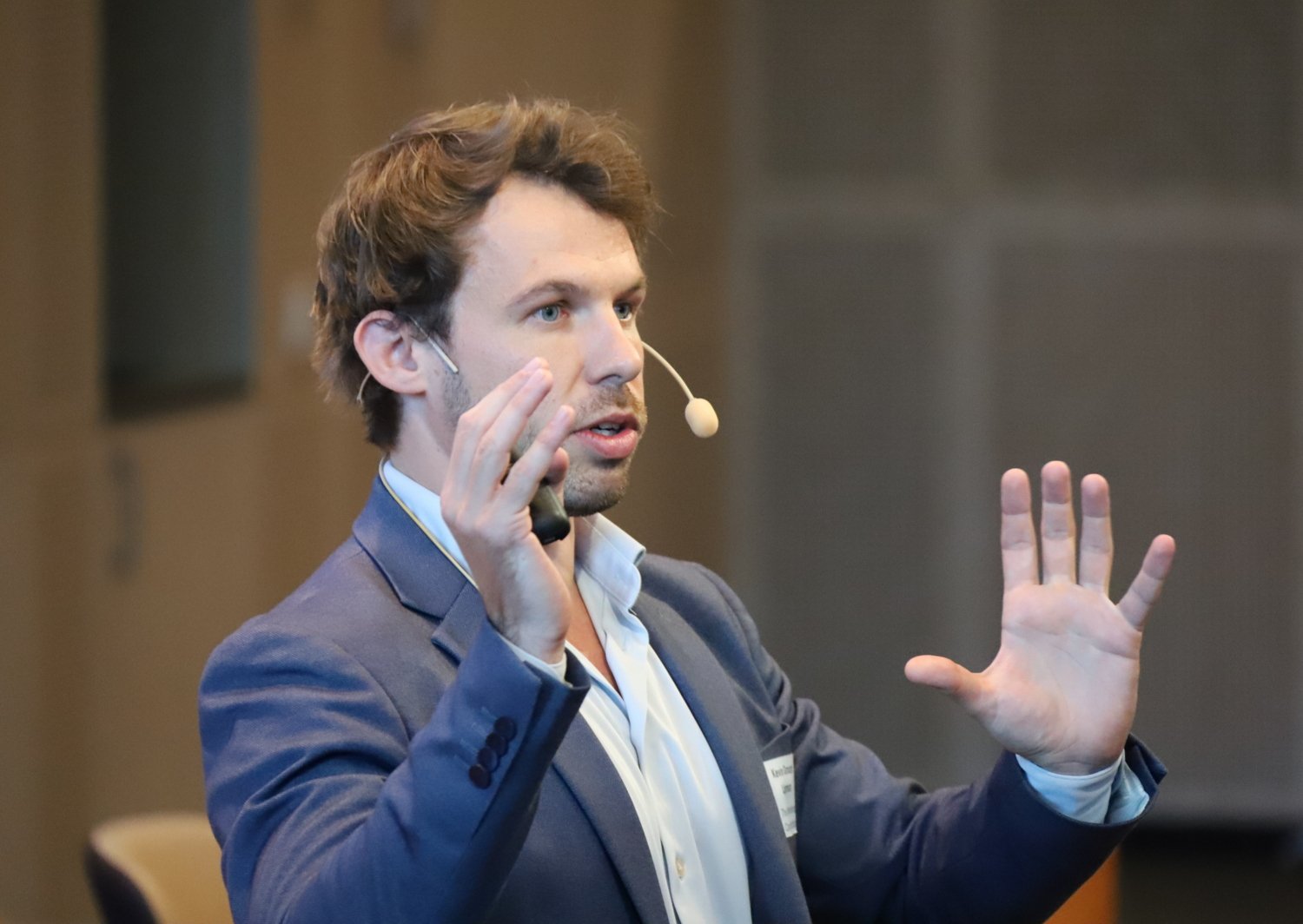 Man speaking and gesticulating