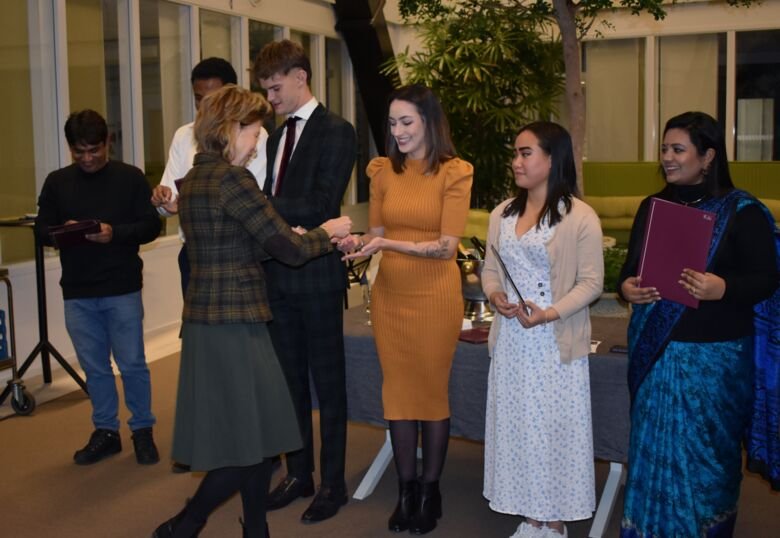 Awarding of scholarships during the ceremony in the Orangery.