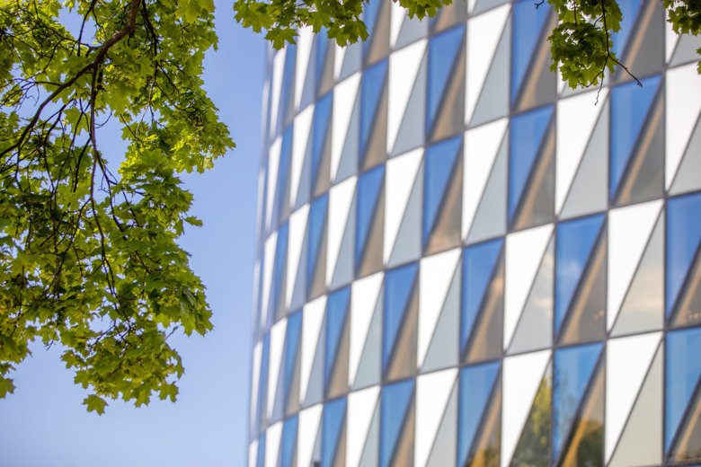 Fasad of Aula Medica with trees in the foregroud