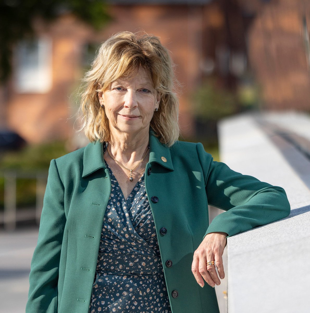 Business dressed woman outside