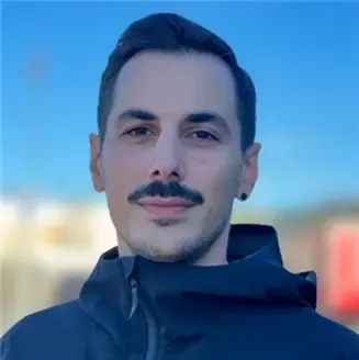 Portrait picture of Konstantinos Chiotis with blue sky as backdrop.