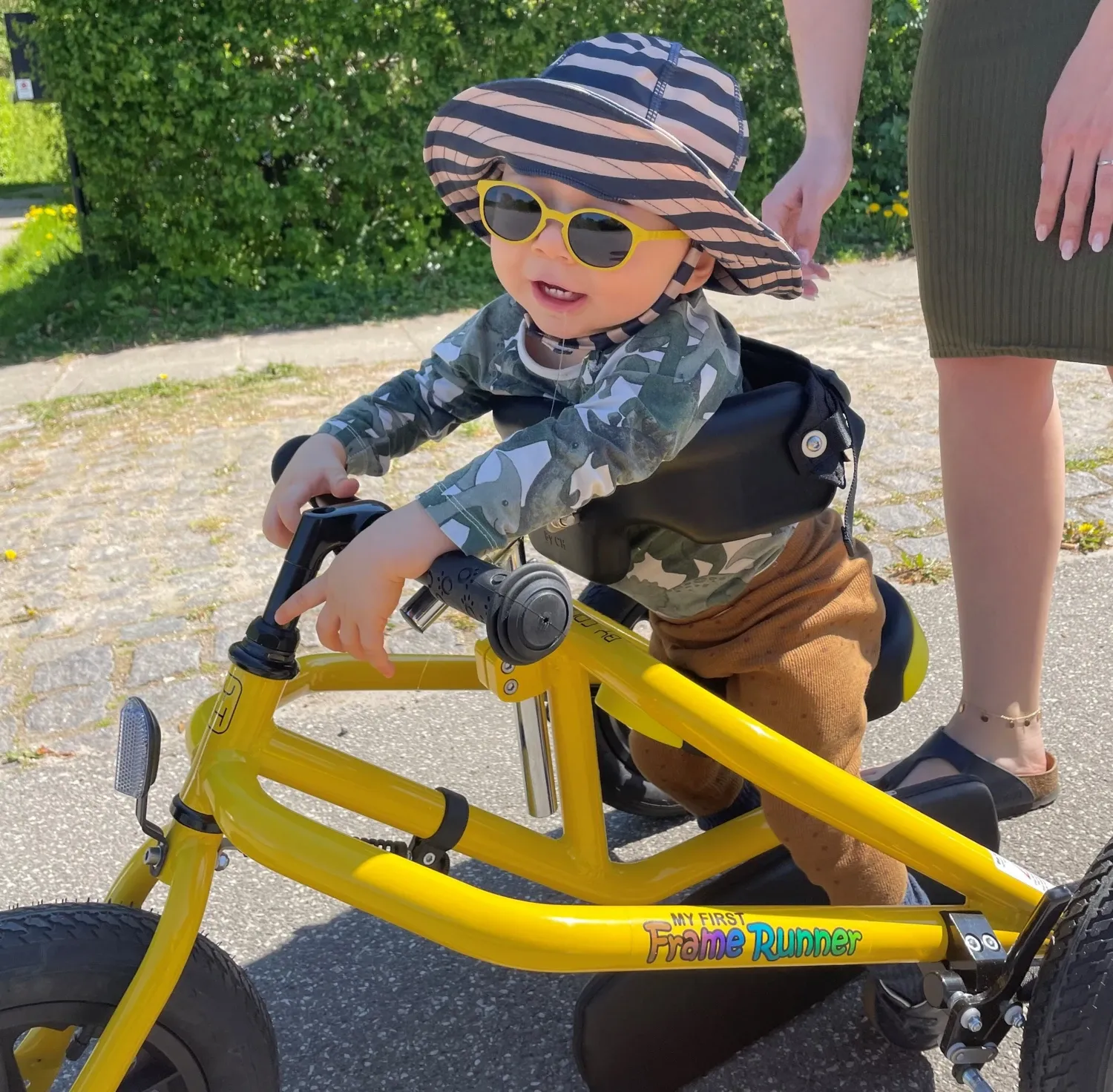 a small child on a specially built bicycle