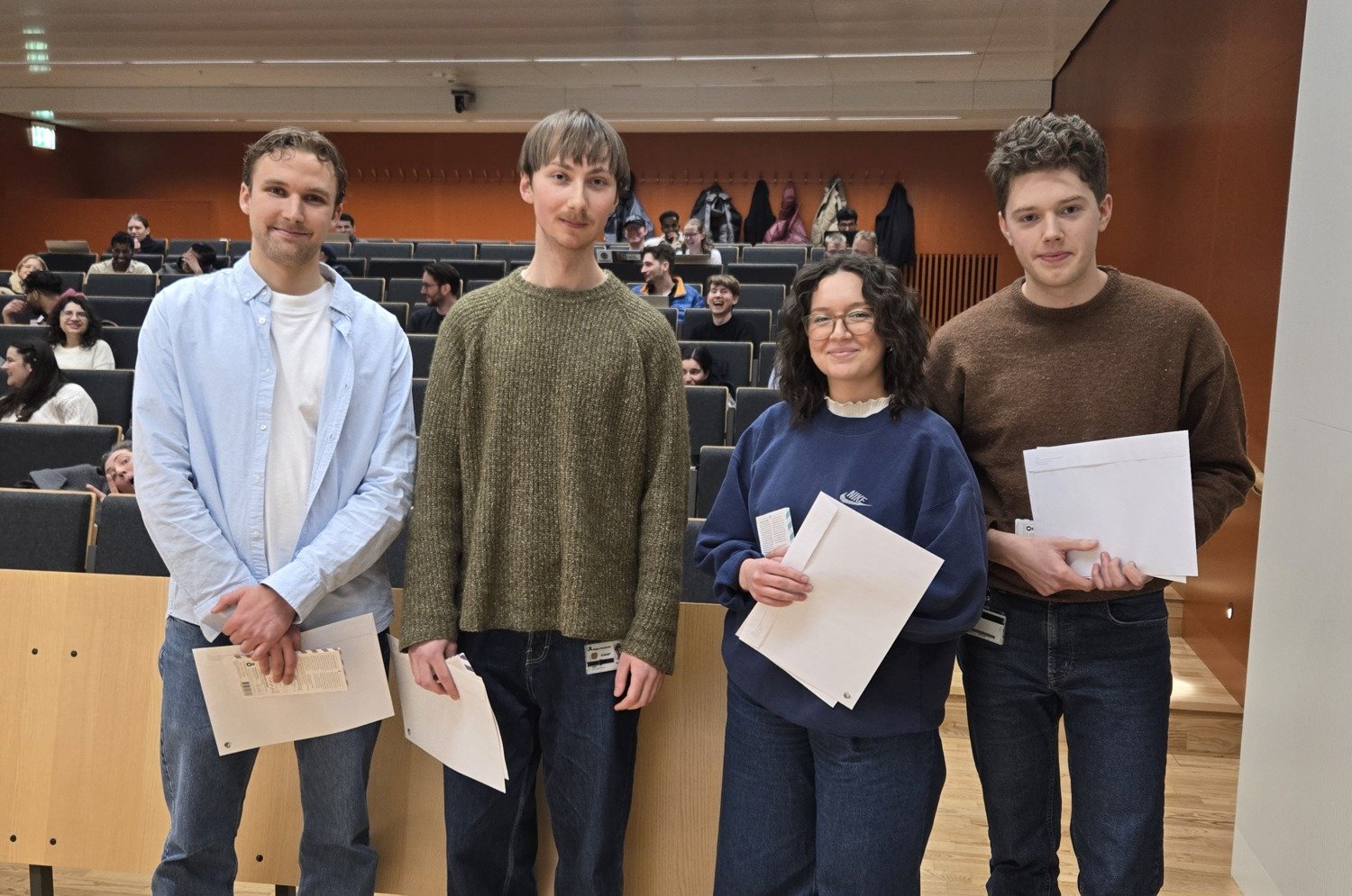 Course leaders award diplomas to talented students in the medical program.
