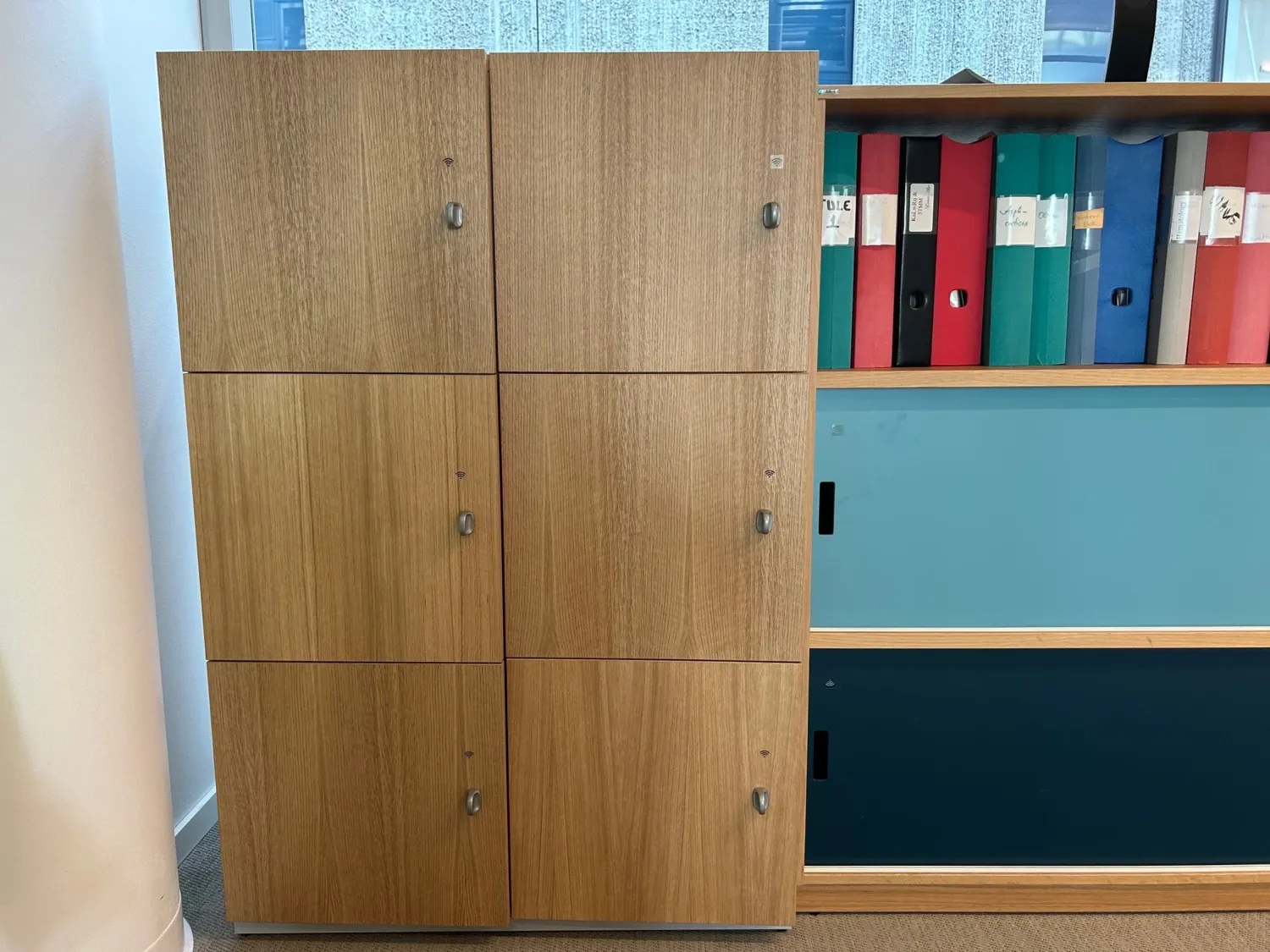 Photo of a wood furniture with 9 lockable cabinets.