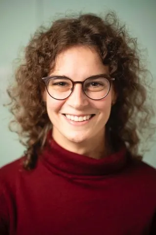 a woman with curly hair