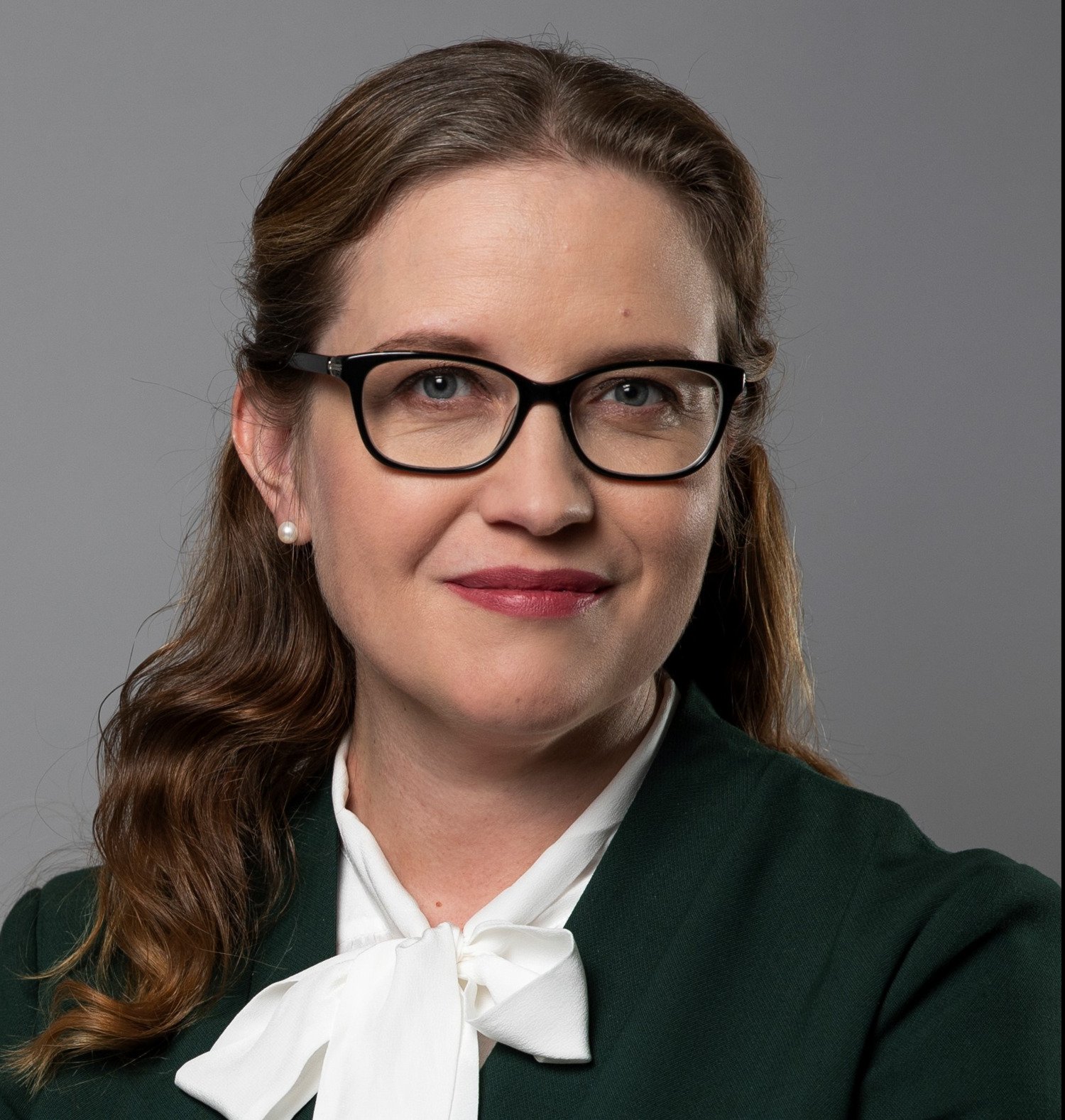 Profile photo of Maja Fjaestad. A woman with a white blouse and glases