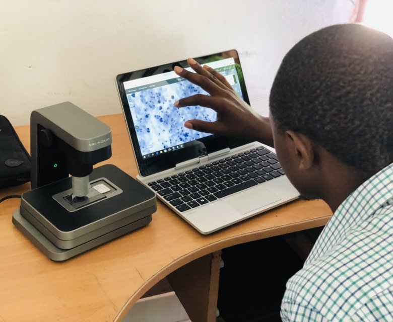Martin Muinde scanning pap smears at the Kinondo clinic in Kenya.