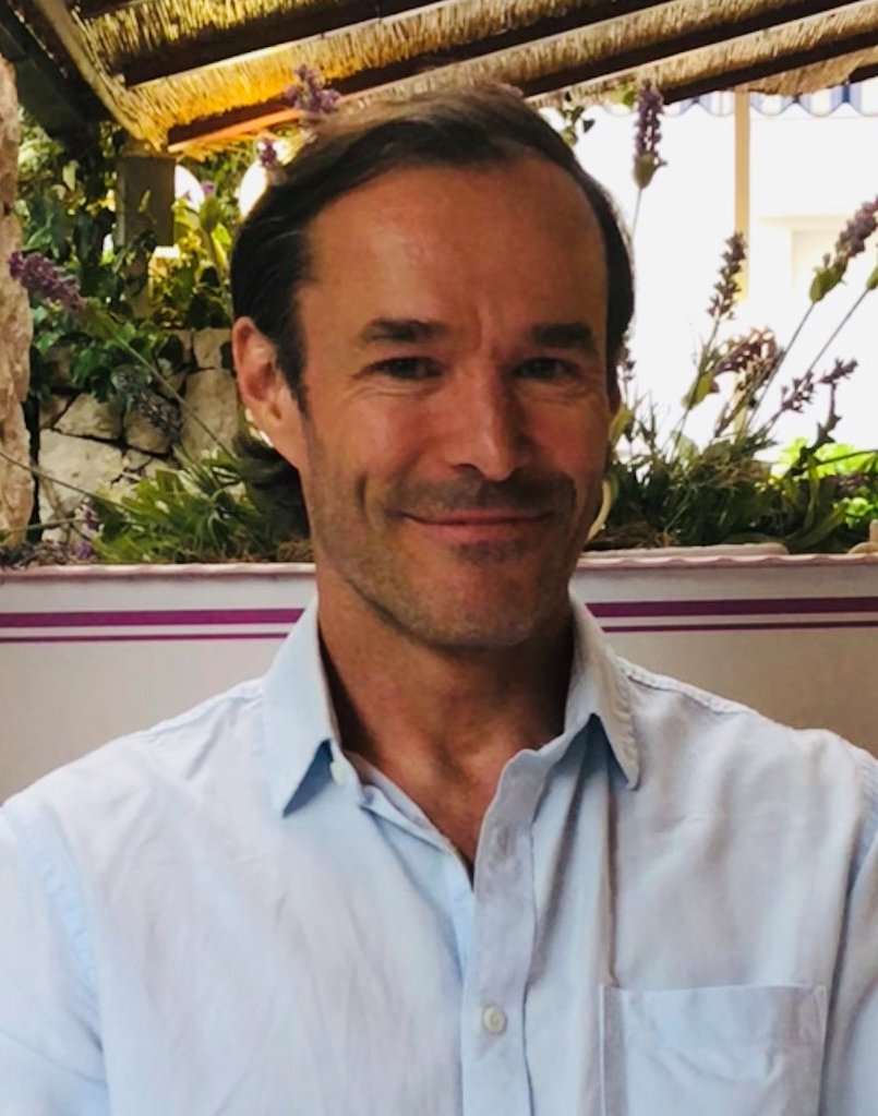 Portrait of Mats Hallgren wearing a blue shirt.