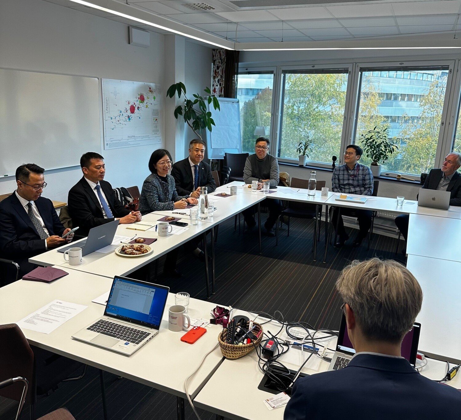 Group of people in a meeting room.