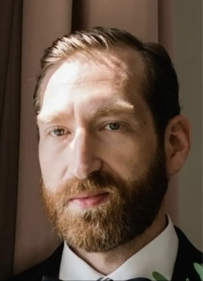 Portrait photo of a man with a beard and mustache.
