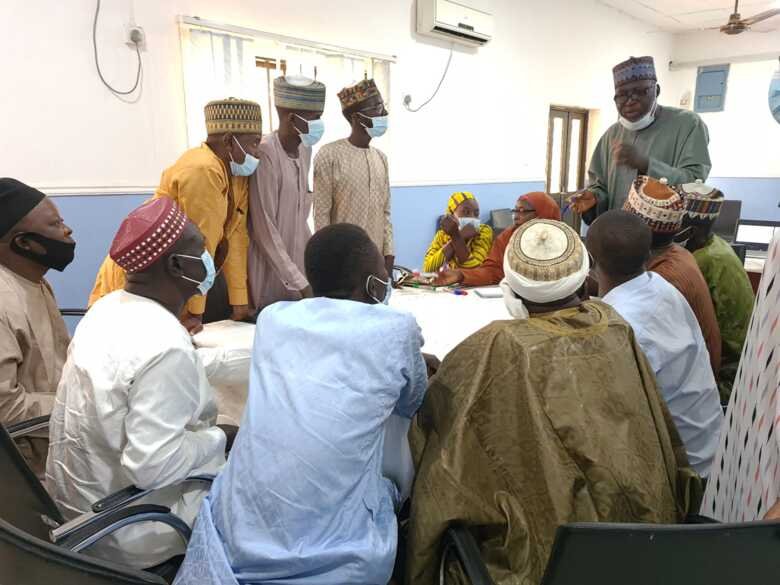 People around table discussing at workshop in Bauchi in Nigeria
