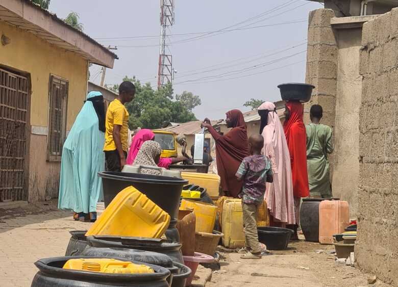 People on the street in north Nigeria getting water
