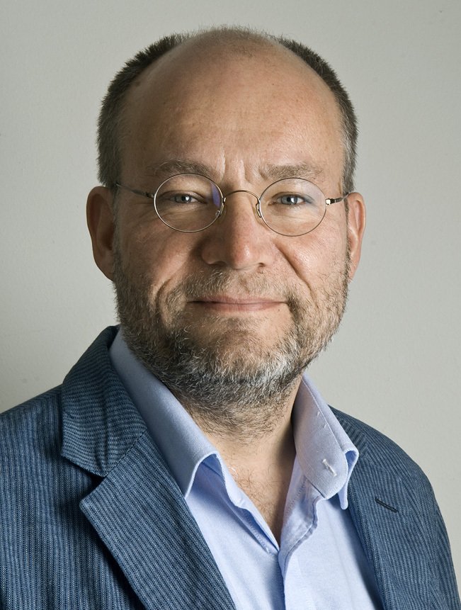 Portrait of Johan against white background.