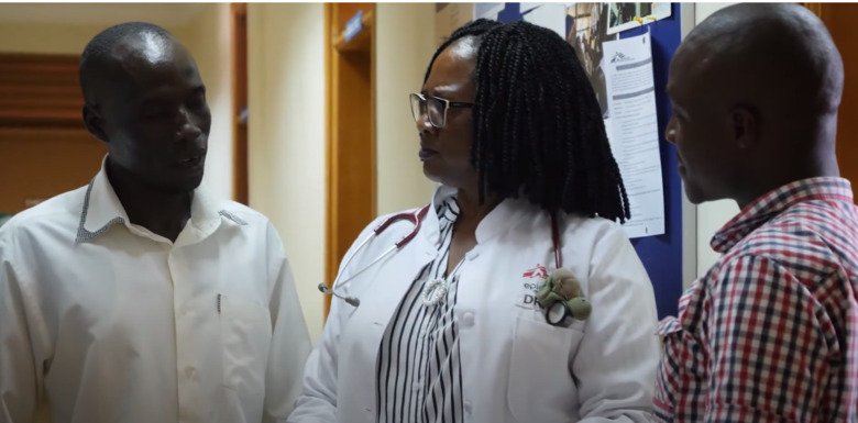 Juliet Mwanga-Amumpaire with two colleagues at Epicentre Mbarara Research Centre.