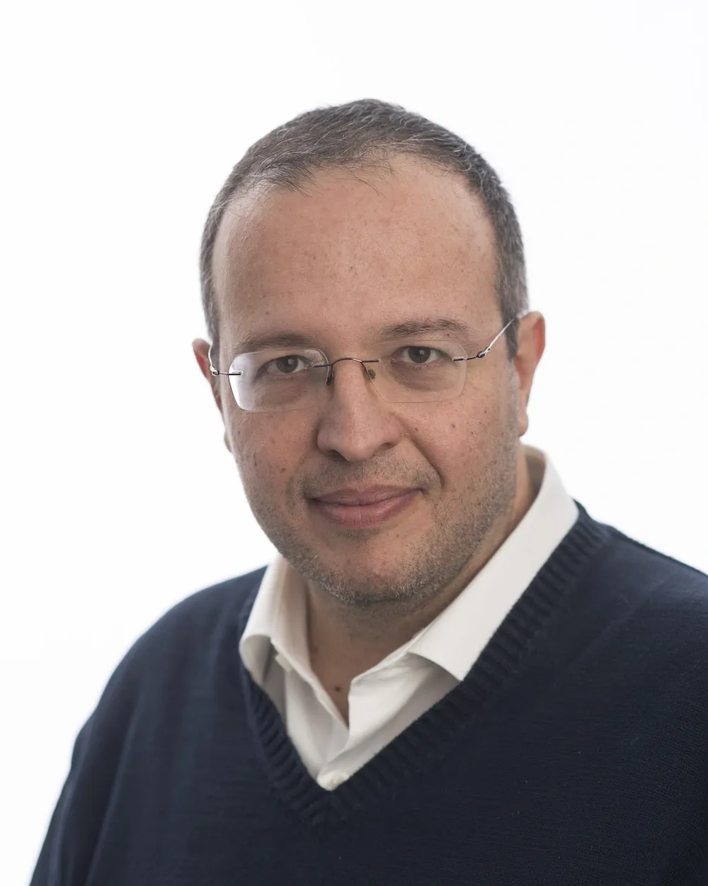 Portrait of Dr Carli in front of a white background.