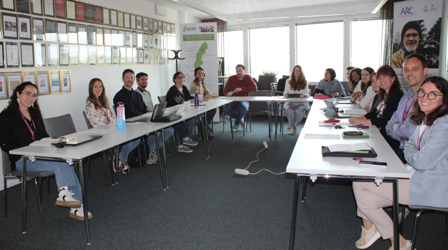 group picture of participants sitting at their tables.