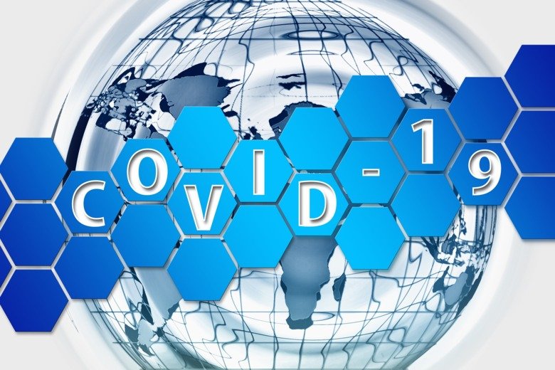 Illustration in blue colours, showing the earth/globe, over this a pattern from cells or a network. The word COVID-19 is written over the illustration.