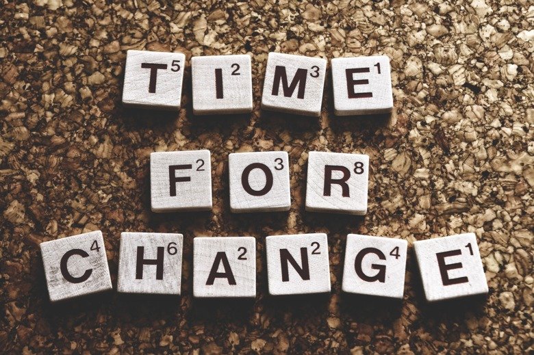 Tiles on a message board that reads: Time for change.