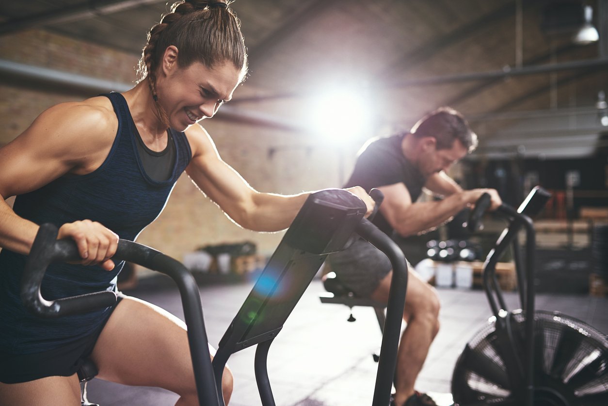 two persons training in gym