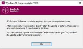 Windows with the text"A Windows 10 feature update is required, this can take up to two hours.