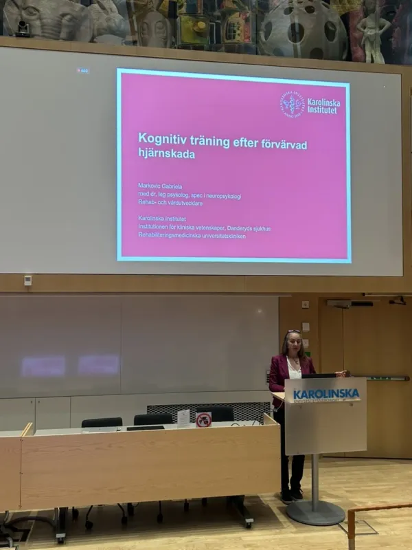A lecture hall with audience and speaker